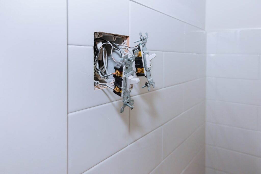 One Thing You Need To Know About The Bath Outlet Location - River City Boston Bright white tile wall ideal for contemporary bathrooms, featuring River City Construction's quality craftsmanship and design.