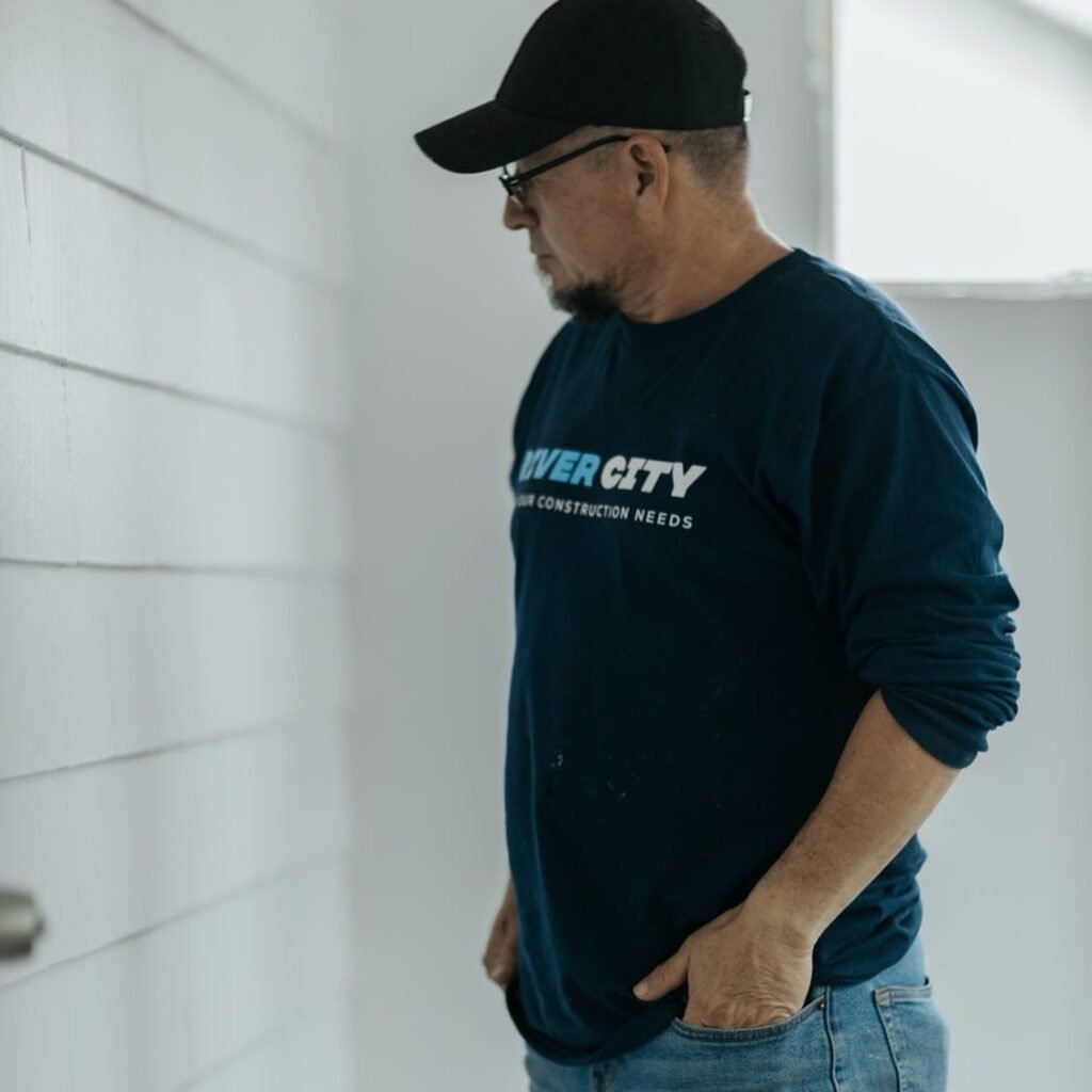 ¿How much cost to remodel a basement? The true cost of basement remodeling Edwin stands proudly in a beautifully renovated basement by River City Construction Inc.