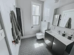 Newly Remodeled Bathroom with Modern Fixtures and Elegant Tile Flooring
