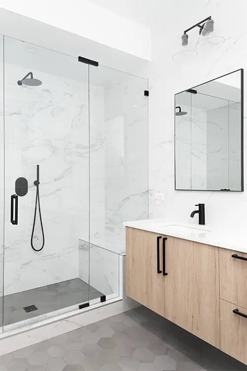 Newly Remodeled Bathroom with Modern Fixtures and Elegant Tile Flooring