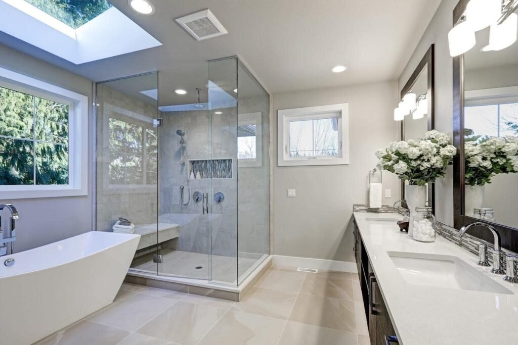 Modern bathroom design with white tiles and black fixtures, ideal for those seeking expert remodeling inspiration by river city construction Medford bathroom remodel expert team.