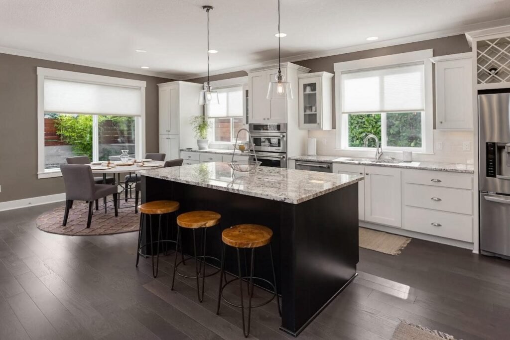 Find Top-Rated Kitchen Remodeling Experts in Boston Modern kitchen featuring a center island and sleek stainless steel appliances, designed by River City Kitchen Remodeling in Somerville, MA.