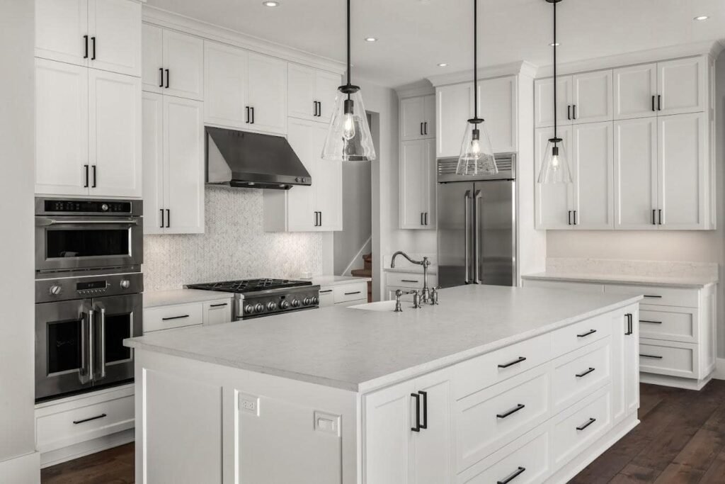 Navigating Kitchen Remodel Cost Estimator: Ultimate Guide Contemporary kitchen with gray cabinets and stainless steel appliances, crafted by River City Kitchen Remodeling in Medford, MA.